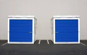 Twin white and blue portable storage containers.